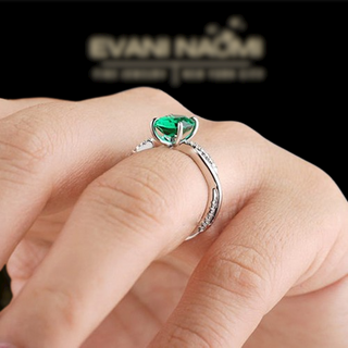 Oval Cut Emerald Green Diamond White Gold Twist Engagement Ring